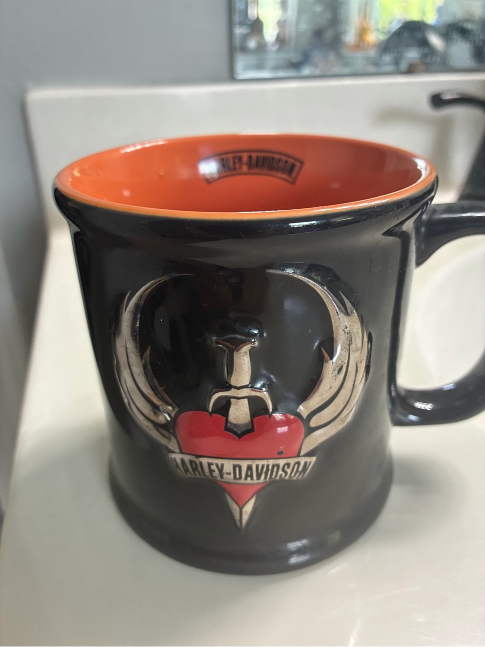 Harley-Davidson Black Mug with Orange Interior and Red Heart Emblem